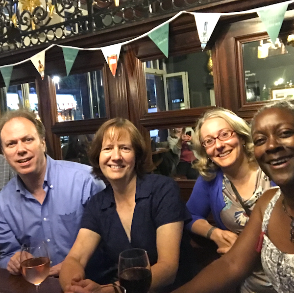 Group of smiling people in a London pub