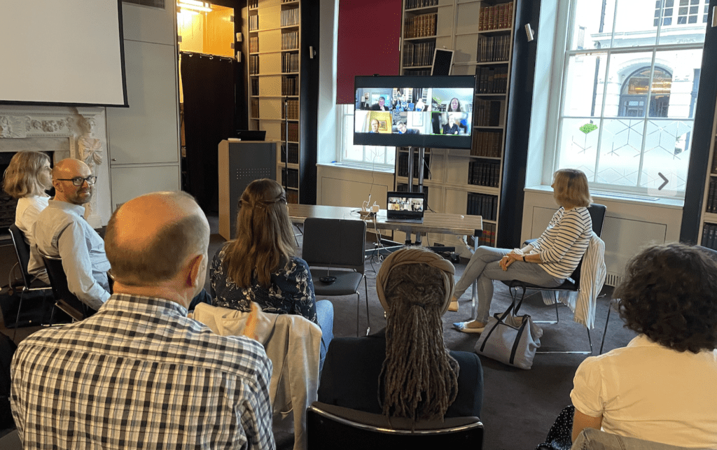 A hybrid meeting in a grand room